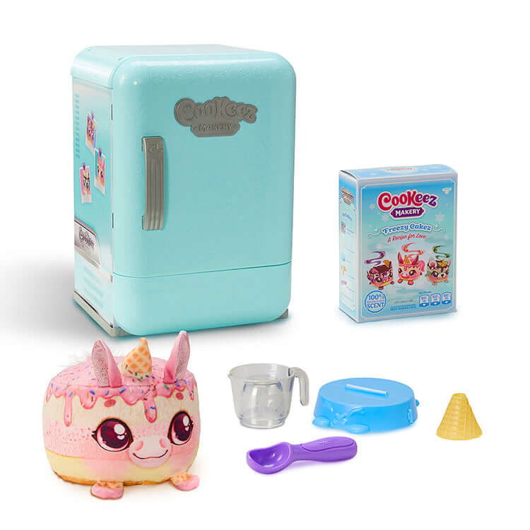 Cookeez Makery Freezy Cakez Playset with toy fridge, plush treat, and accessories for kids' fun and creativity.