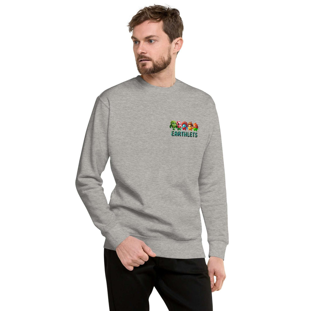 Man wearing Earthlets unisex premium sweatshirt in gray, featuring colorful logo on chest, showcasing modern streetwear style.