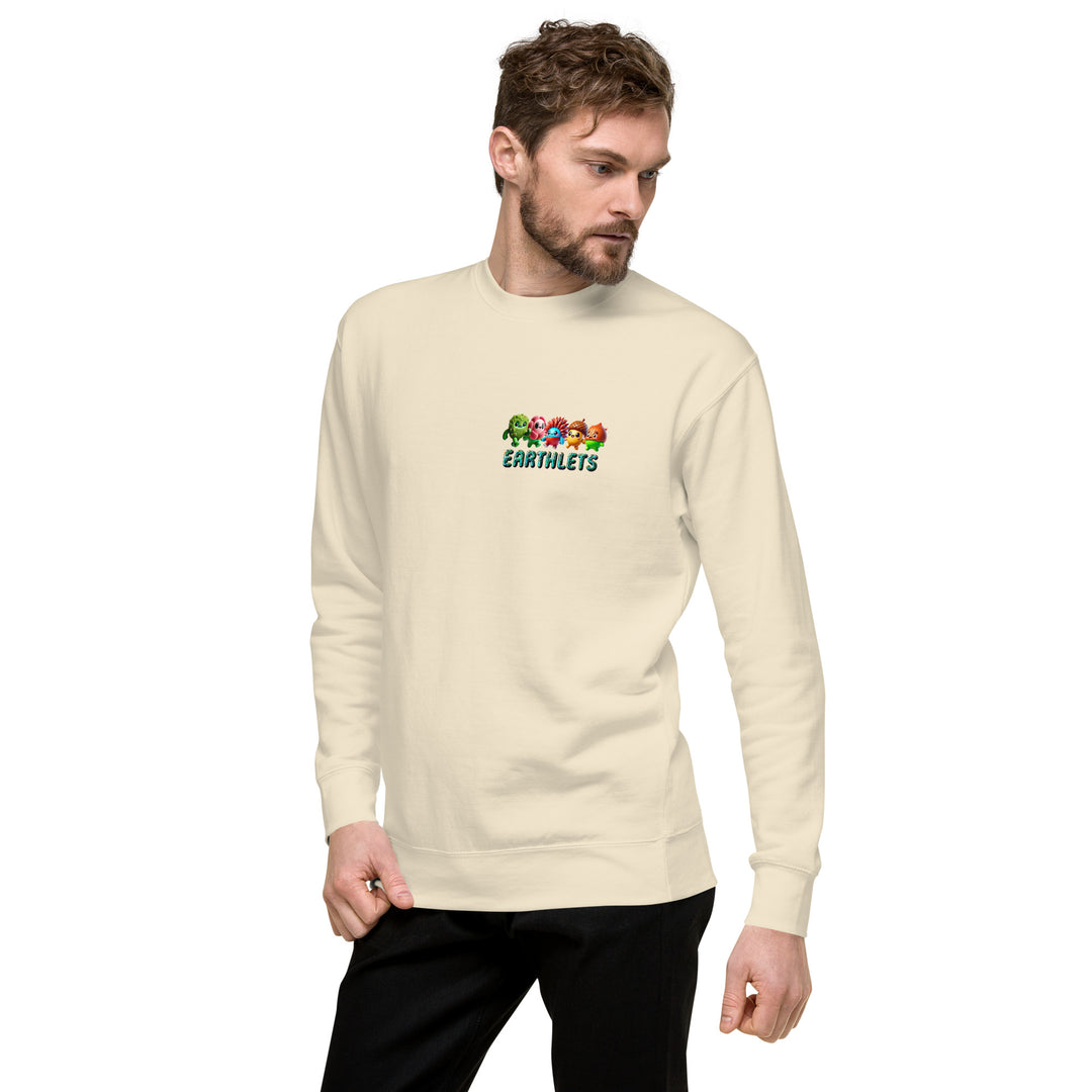 Model wearing Earthlets unisex premium sweatshirt in cream color, showcasing a vibrant graphic design.