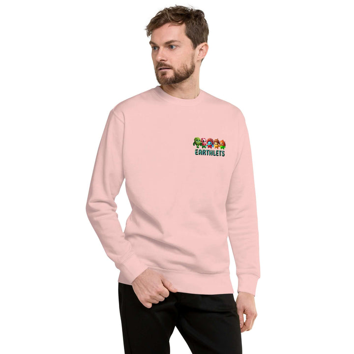Man in pink Earthlets unisex premium sweatshirt, showcasing its comfortable style and soft fleece interior.