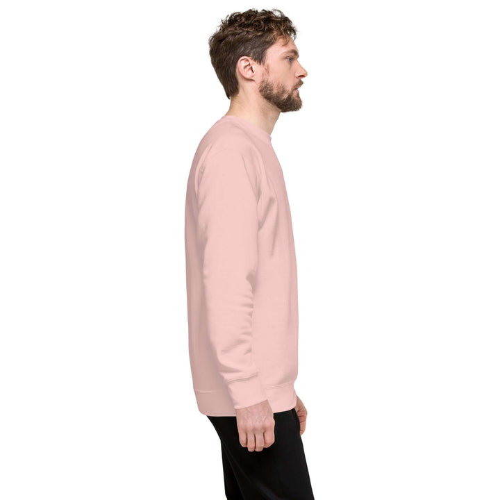 Side view of man wearing Earthlets Unisex Premium Sweatshirt in soft pink color.