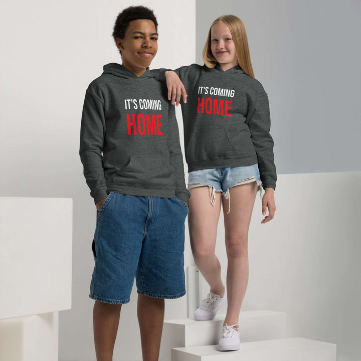 Youth heavy blend hoodie in grey worn by two kids, promoting comfort and style with text &