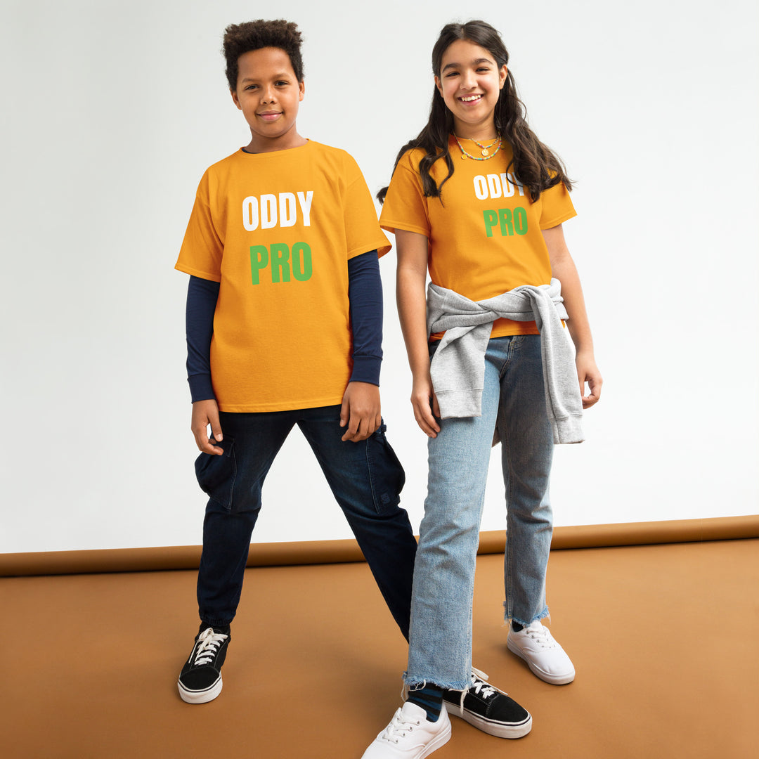 Two kids wearing Oddy Pro youth classic t-shirt in bright orange, showcasing comfort and style for active wearers.