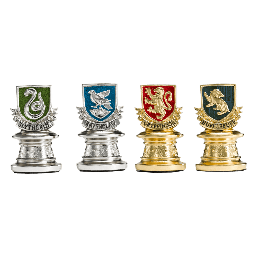 Quidditch Chess Set pieces representing Slytherin, Ravenclaw, Gryffindor, and Hufflepuff houses.