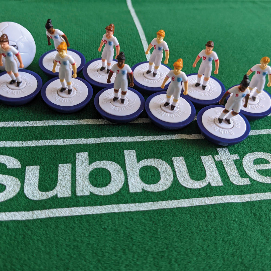 Subbuteo Lionesses Main Game - figurines of England Lionesses players on the pitch.