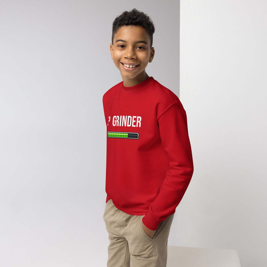 XP Grinder Youth crewneck sweatshirt in red worn by a smiling boy, perfect for adventures and casual lounging.