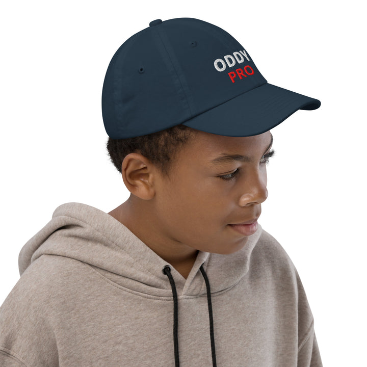 Oddy Pro Youth baseball cap worn by a child, showcasing its stylish design and comfortable fit.